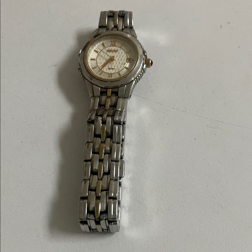 Seiko Two-Tone Silver and Gold Watch -Auctioneer Woman says it must be SOLD